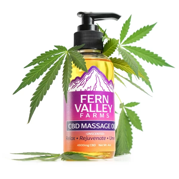 cbd massage oil 4oz from fern valley farms, covered in hemp leaves